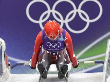 Sīva cīņa līdz pēdējai simtdaļai: sieviešu vieninieki olimpiskajā trasē Kortīnā